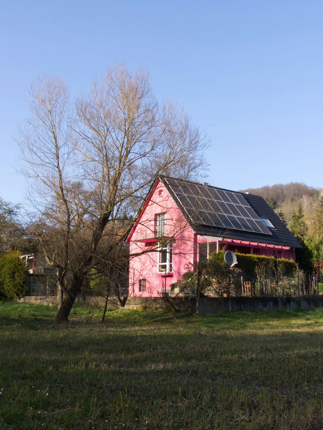 a-red-barn-with-a-black-roof-8ap33alpmgy