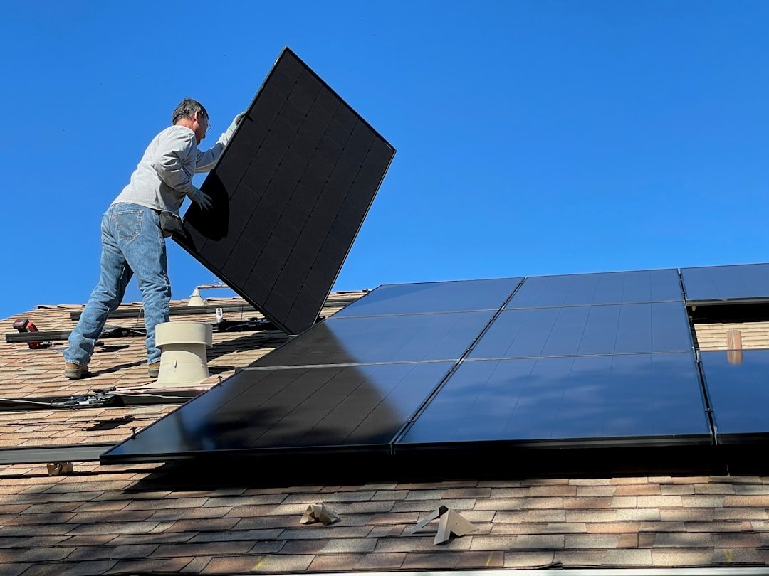 Mastering the First Impression: Your intriguing post title goes here Worker installing solar panels on a roof